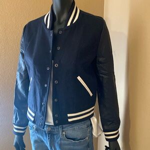 Varsity style women’s jacket in dark navy.
